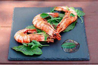 Grilled shrimps on slate plate